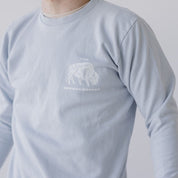 Light blue long-sleeve sweatshirt with a white Regenaissance bison graphic and text on a plain background