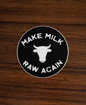 The Make Milk Raw Again Sticker by Sticker Mule is a round black vinyl sticker featuring a white cow head silhouette and bold “MAKE MILK RAW AGAIN” text, perfect for celebrating traditional dairy and dedicated farmers.