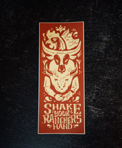 The Shake Your Ranchers Hand Sticker by Sticker Mule is a rectangular vinyl sticker with a cow skull, chicken, and handshake illustration, plus the phrase SHAKE YOUR RANCHERS HAND in brown and cream on a dark background.