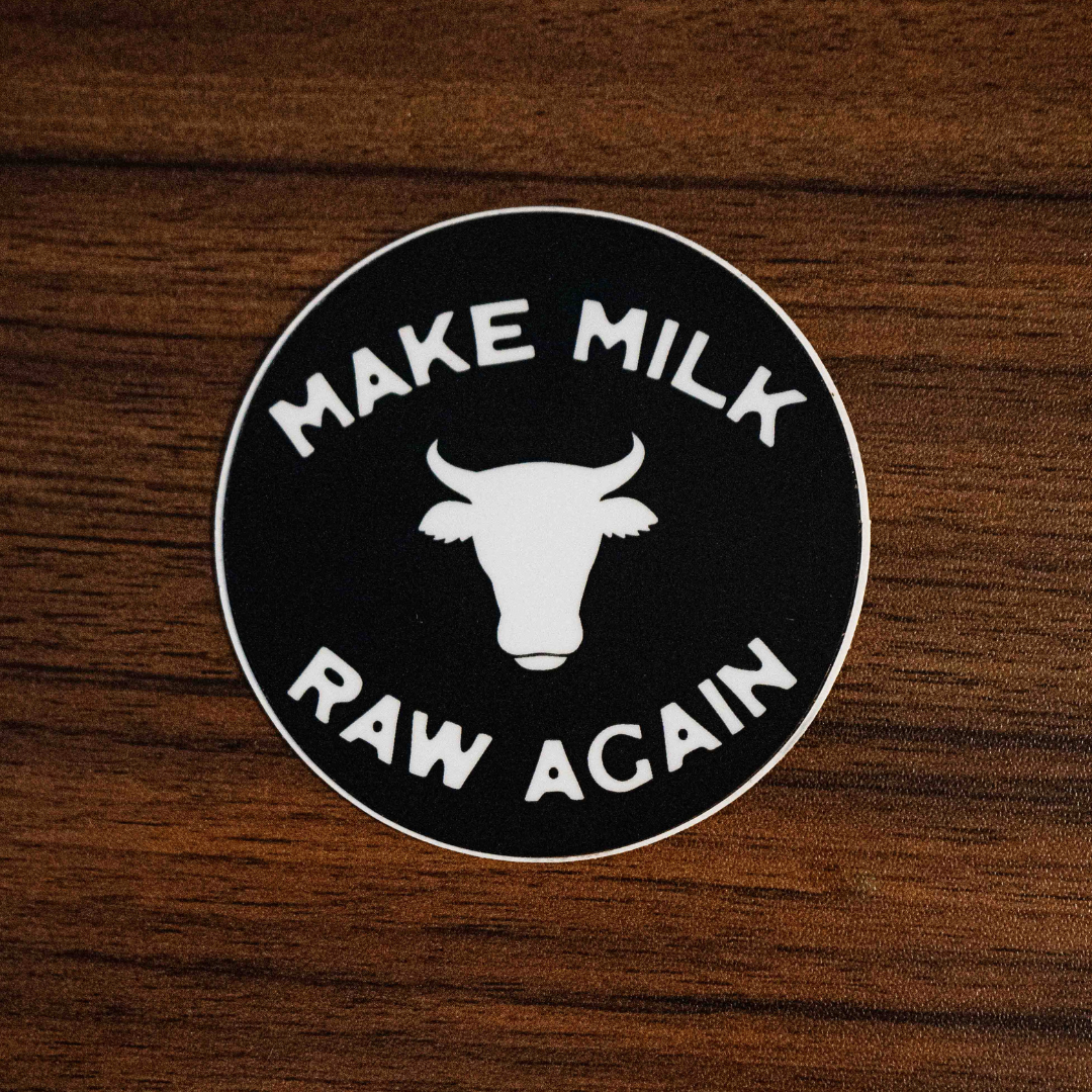 The Make Milk Raw Again Sticker by Sticker Mule is a round black vinyl sticker featuring a white cow head silhouette and bold “MAKE MILK RAW AGAIN” text, perfect for celebrating traditional dairy and dedicated farmers.