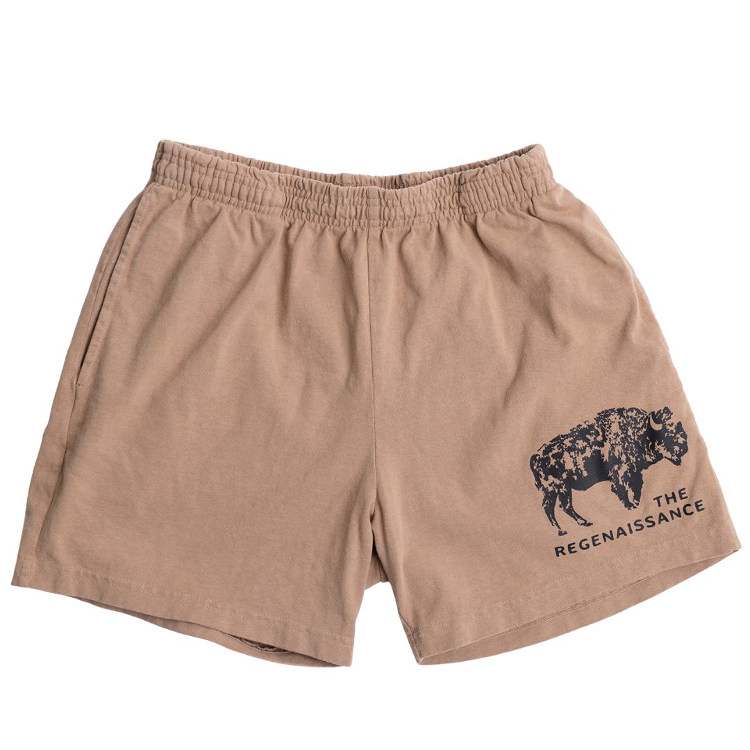 Los Angeles Apparel Men's Bison Shorts in khaki feature an elastic waistband, a black buffalo illustration, and “THE REGENAISSANCE” text on the front left leg—ideal for fans of regenerative living.