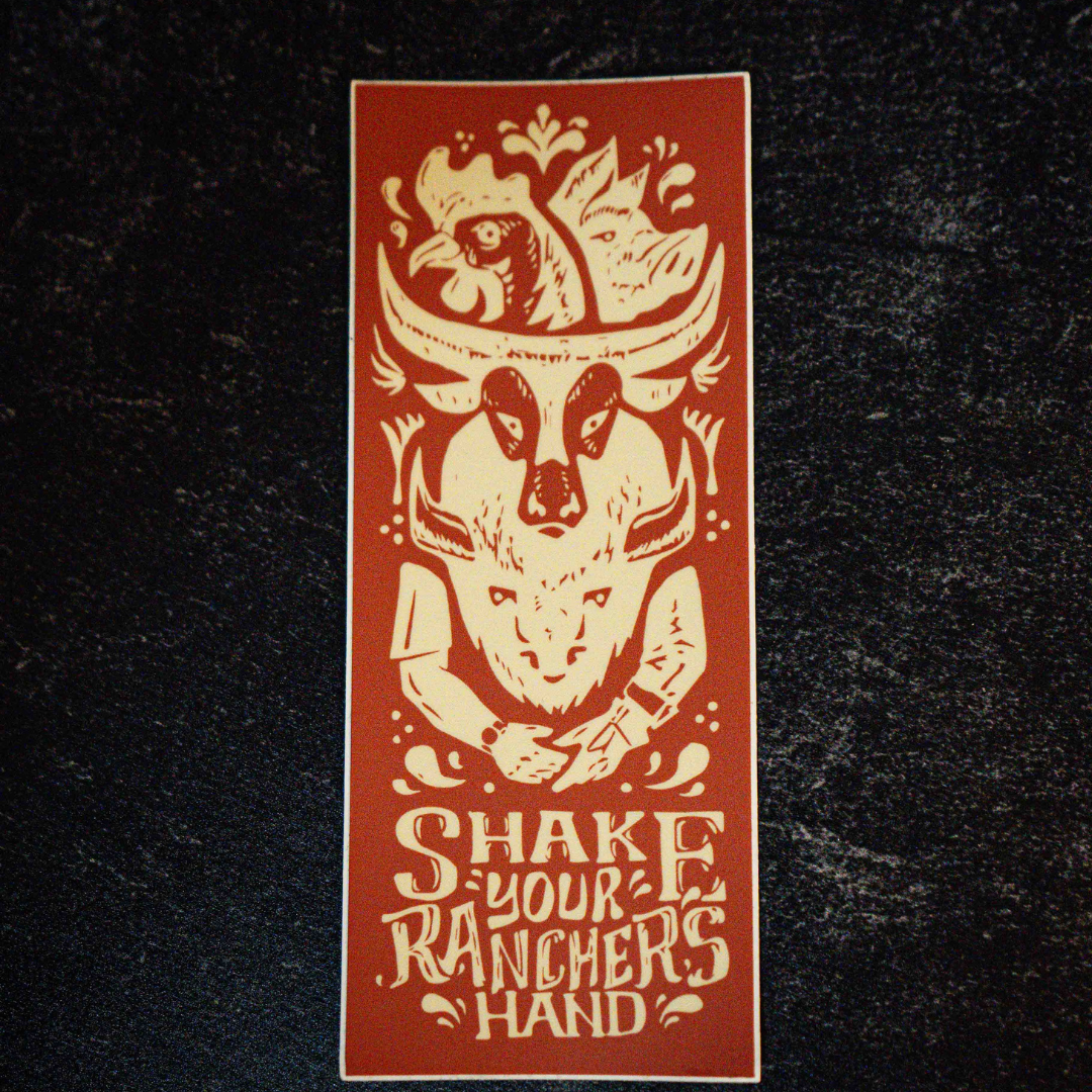 The Shake Your Ranchers Hand Sticker by Sticker Mule is a rectangular vinyl sticker with a cow skull, chicken, and handshake illustration, plus the phrase SHAKE YOUR RANCHERS HAND in brown and cream on a dark background.