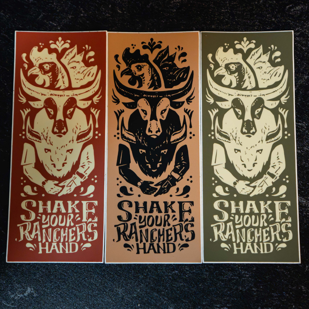 The Regenaissance Sticker Pack from Sticker Mule features three rectangular vinyl stickers with a stylized goat skull above “SHAKE YOUR RANCHER’S HAND.” Each design highlights real food and regenerative agriculture in earthy tones on a dark textured background.