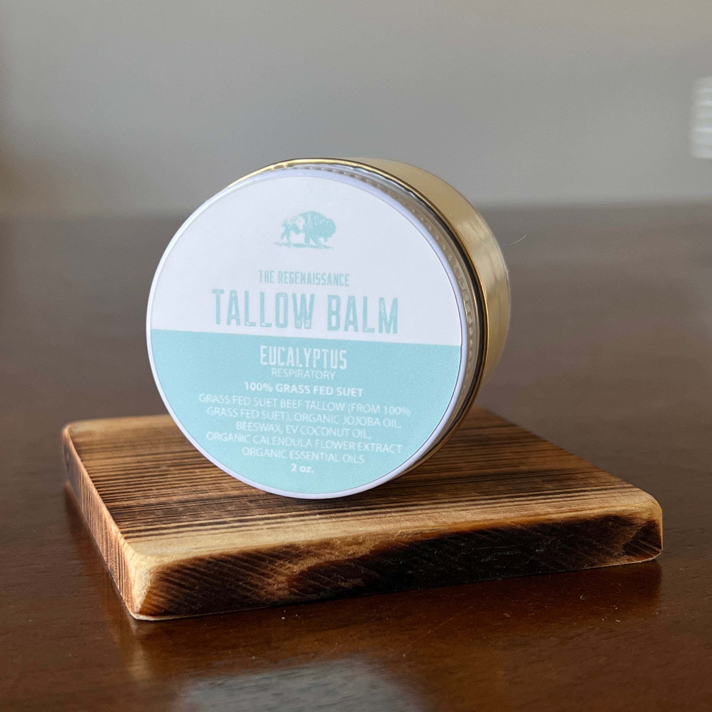 Jar of Eucalyptus Tallow Balm on a wooden shelf in on its side