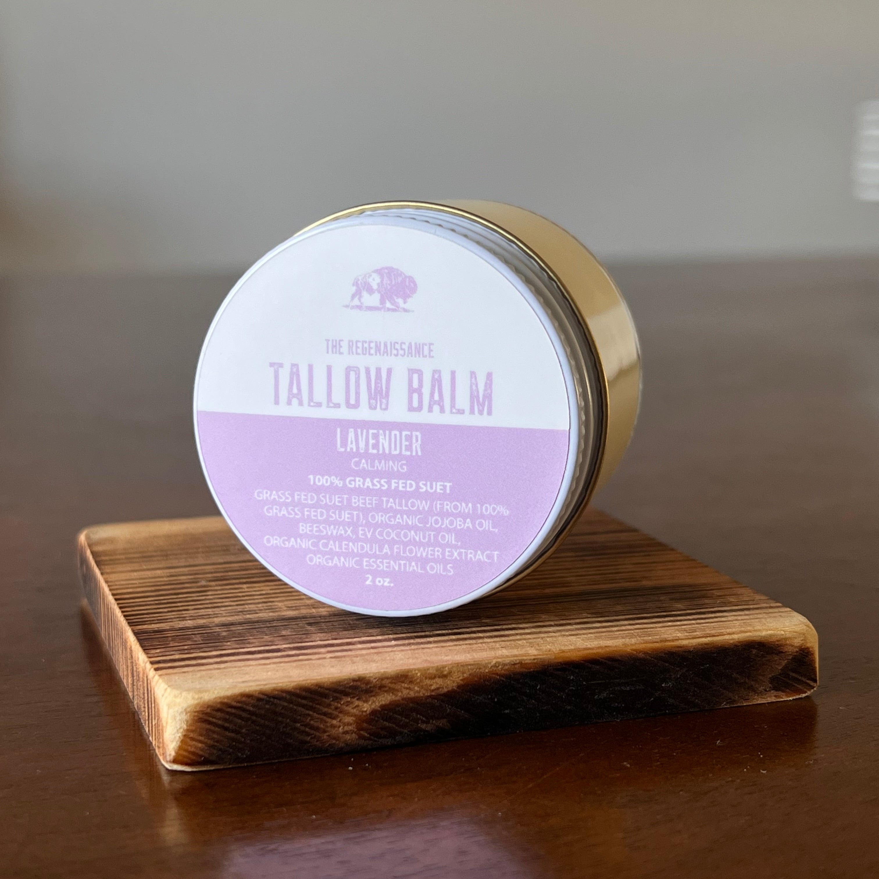 Jar of Lavender Tallow Balm on a wooden shelf in on its side